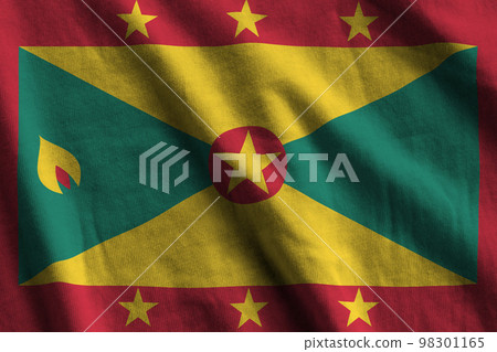 Grenada flag with big folds waving close up under the studio light indoors. The official symbols and colors in banner Grenada flag with big folds waving close up under the studio light indoors. The official symbols and colors in banner 98301165