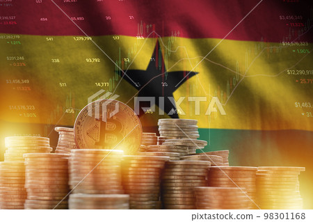 Ghana flag and big amount of golden bitcoin coins and trading platform chart. Crypto currency 98301168