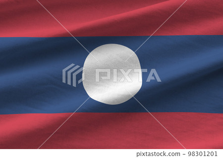 Laos flag with big folds waving close up under the studio light indoors. The official symbols and colors in banner Laos flag with big folds waving close up under the studio light indoors. The official symbols and colors in banner 98301201