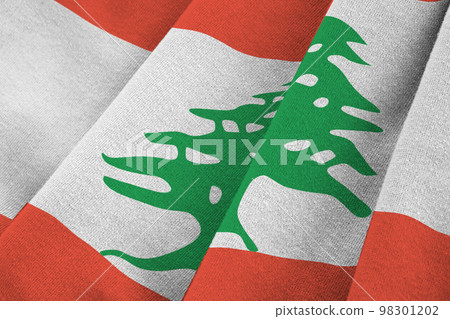 Lebanon flag with big folds waving close up under the studio light indoors. The official symbols and colors in banner Lebanon flag with big folds waving close up under the studio light indoors. The official symbols and colors in banner 98301202