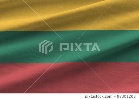 Lithuania flag with big folds waving close up under the studio light indoors. The official symbols and colors in banner 98301208