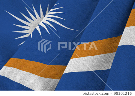 Marshall Islands flag with big folds waving close up under the studio light indoors. The official symbols and colors in banner Marshall Islands flag with big folds waving close up under the studio light indoors. The official symbols and colors in banner 98301216