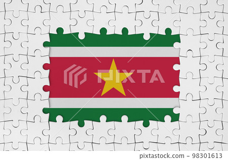 Suriname flag in frame of white puzzle pieces with missing central part 98301613