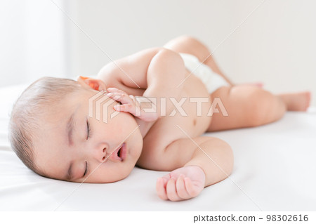 sleeping face of a 4 month old baby sleeping face of a 4 month old baby 98302616