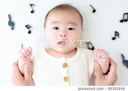 Musical note and baby Hand play Singing image Musical note and baby Hand play Singing image 98302646