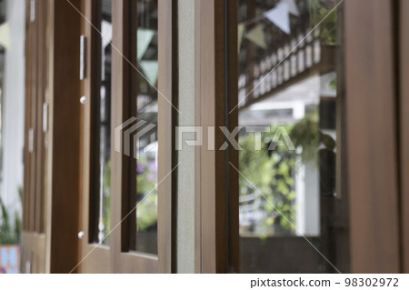 Festive colorful flags decorated on wooden architecture 98302972