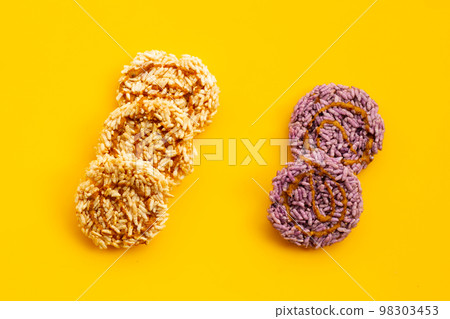 Rice cracker with coconut palm sugar on yellow background. 98303453