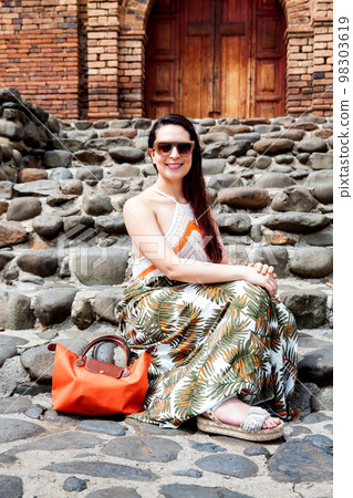 Beautiful young woman at the historical San Antonio Church located in the city of Cali in Colombia Beautiful young woman at the historical San Antonio Church located in the city of Cali in Colombia 98303619