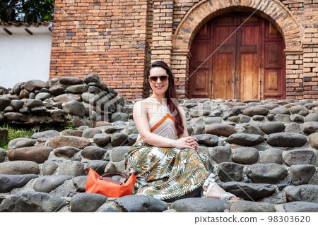 Beautiful young woman at the historical San Antonio Church located in the city of Cali in Colombia Beautiful young woman at the historical San Antonio Church located in the city of Cali in Colombia 98303620