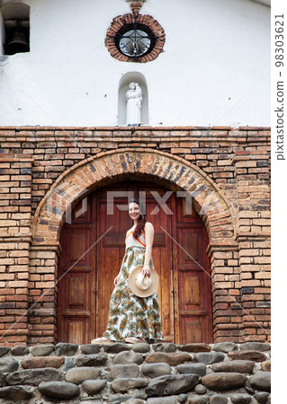 Beautiful young woman at the historical San Antonio Church located in the city of Cali in Colombia Beautiful young woman at the historical San Antonio Church located in the city of Cali in Colombia 98303621