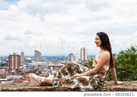 Beautiful young woman at the San Antonio hill located in the city of Cali in Colombia Beautiful young woman at the San Antonio hill located in the city of Cali in Colombia 98303623