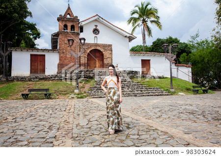 Beautiful young woman at the historical San Antonio Church located in the city of Cali in Colombia 98303624
