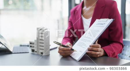 Business woman or Real Estate agent explain signing agreement for buying house. Bank manager and real estate concept 98303866