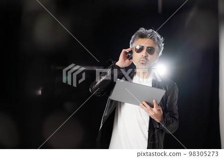 man working behind the scenes man working behind the scenes 98305273