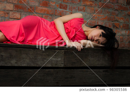 Taiwanese Chinese young woman looking sad Taiwanese Chinese young woman looking sad 98305586