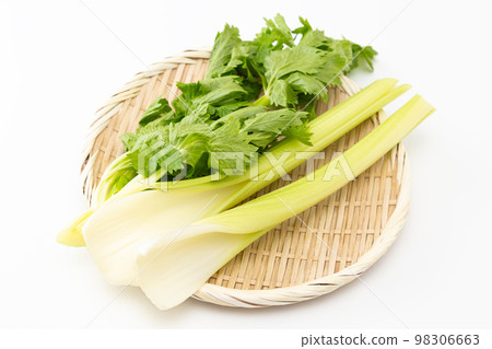 Celery in a colander white background 98306663