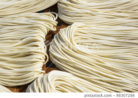 Close-up of traditional handmade noodle-making drying outdoors in Guanmiao, Tainan, Taiwan. 98307286