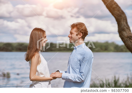 portrait of a man and a woman in love . 98307700