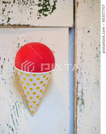 plastic ice cream waffle in white wooden background. 98307707