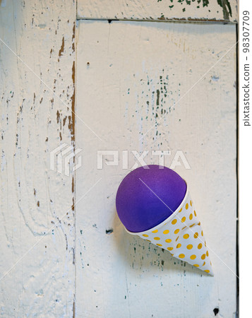 plastic ice cream waffle in white wooden background. 98307709