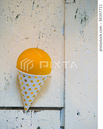 plastic ice cream waffle in white wooden background. plastic ice cream waffle in white wooden background. 98307711