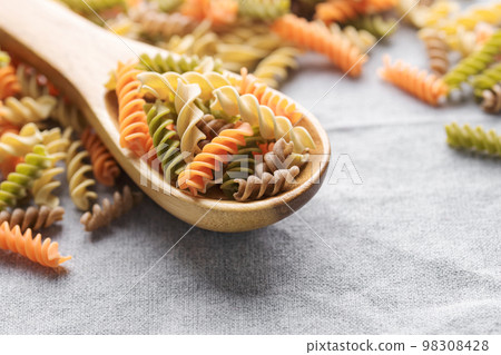 A variety of fusilli pasta made from different types of legumes, green and red lentils, mung beans and chickpeas. Gluten-free pasta. 98308428