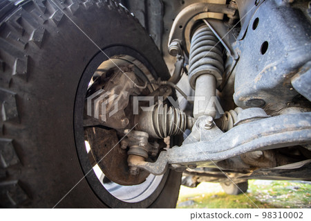 Car steering and suspension system of a suv. Close-up of front wheel drive and suspension 98310002