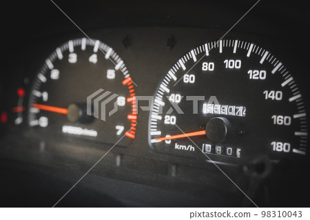 Close-up of a speedometer and tachometer in a used car 98310043