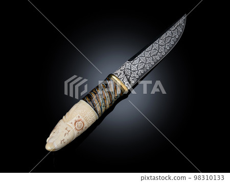 souvenir collectible silver gold dagger cutlass with scabbard, with metal engraving, Bone handle on black. Luxury weapons with traditional patterns in medieval vintage viking shamanic style souvenir collectible silver gold dagger cutlass with scabbard, with metal engraving, Bone handle on black. Luxury weapons with traditional patterns in medieval vintage viking shamanic style 98310133