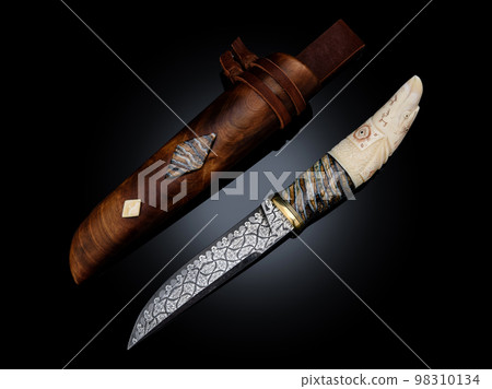 souvenir collectible silver gold dagger cutlass with scabbard, with metal engraving, Bone handle on black. Luxury weapons with traditional patterns in medieval vintage viking shamanic style souvenir collectible silver gold dagger cutlass with scabbard, with metal engraving, Bone handle on black. Luxury weapons with traditional patterns in medieval vintage viking shamanic style 98310134