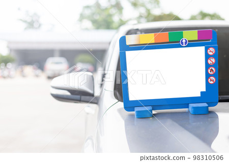 Blue car stand in front of the car when filling fuel to car in Petrol station. White empty space for text 98310506
