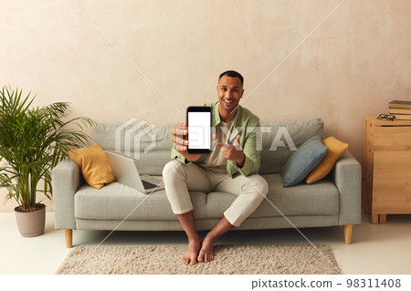 Man Showing Smartphone At Home. Guy Demonstrating Mobile With Blank White Screen Man Showing Smartphone At Home. Guy Demonstrating Mobile With Blank White Screen 98311408