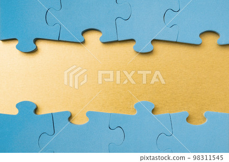 Blue puzzle border with golden background Blue puzzle border with golden background 98311545