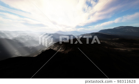 Alpine chains shrouded in the morning fog Alpine chains shrouded in the morning fog 98311628