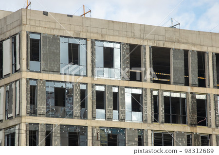 Modern tall house under construction close up 98312689