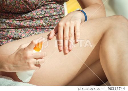 young woman sunbathing young woman sunbathing 98312744