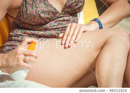 young woman sunbathing 98312828