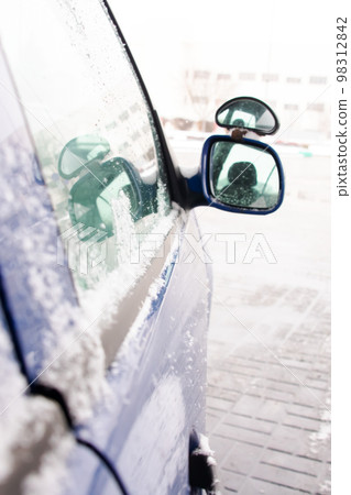 Side mirror of the car in the snow 98312842