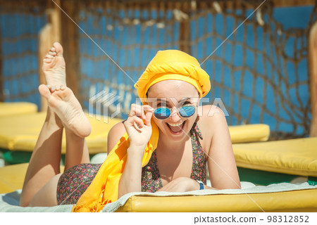 young woman sunbathing young woman sunbathing 98312852