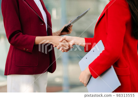 Two confident business man shaking hands during a meeting in the office, success, dealing, greeting and partner Two confident business man shaking hands during a meeting in the office, success, dealing, greeting and partner 98313555