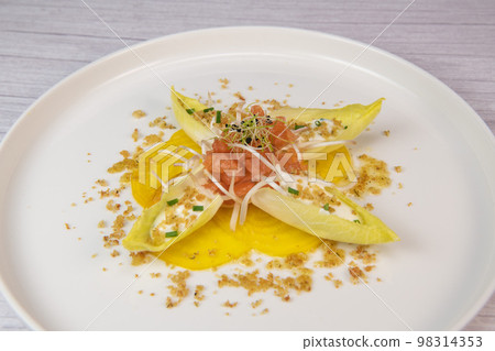 Recipe for salmon gravlax salad, endives filled with creame fresh, chives, yellow chioggia beetroot Recipe for salmon gravlax salad, endives filled with creame fresh, chives, yellow chioggia beetroot 98314353
