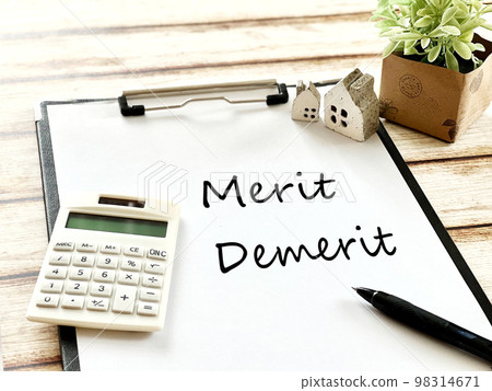 Two household items, a calculator, a clipboard, and Merit and Demerit letters 98314671