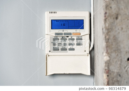Home security alarm system remote control on the wall Home security alarm system remote control on the wall 98314879