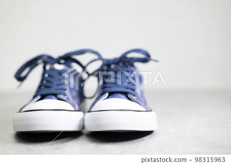 close up of denim sneakers 98315963