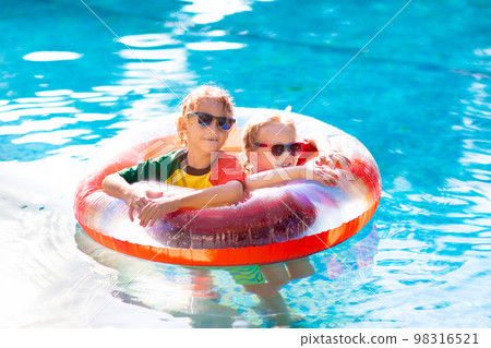 Kids in swimming pool. Life jacket for child. Kids in swimming pool. Life jacket for child. 98316521