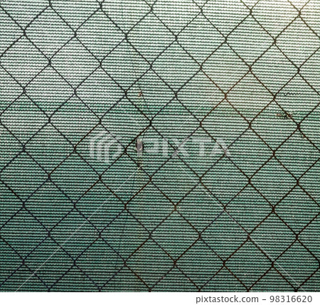 Metal mesh fence and synthetic fabric. Metal mesh fence and synthetic fabric. 98316620