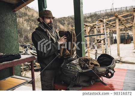New soldier taking military uniform from the bag 98316872