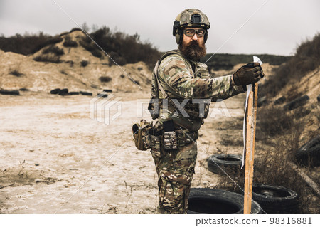 Soldier in camouflage having shooting training 98316881