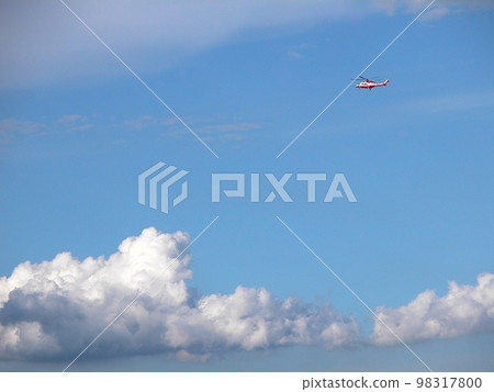 A day in early summer. One helicopter in the longing indigo sky. Head northwest through the clouds. 98317800