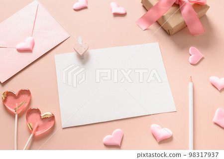 Valentine's day card with envelope and pink lollipops as heart. Valentine's day card with envelope and pink lollipops as heart. 98317937